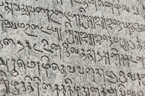 Indian inscriptions carved into a temple wall