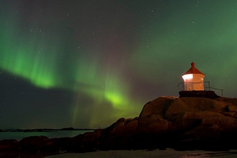 Northern Lights over a lighthouse
