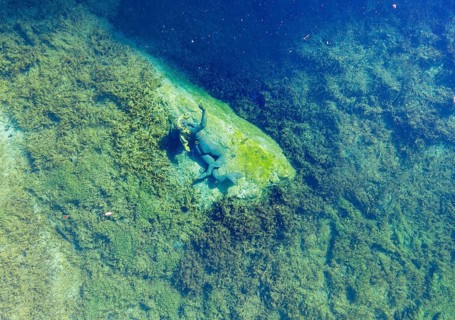 Life-sized sculpture of a mermaid in Lake Badersee