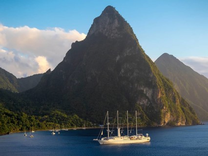 Sailing cruise ship Wind Star of Windstar Cruises in front of the volcanoes Gros Piton and Petit Piton