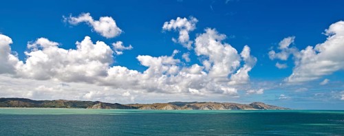 Coastal landscape with cumulus clouds