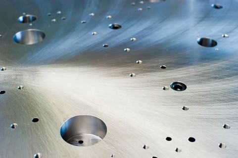 Cut metal surface with drilled holes