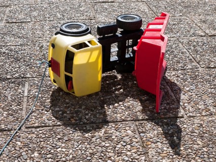 Toppled over toy dumper truck