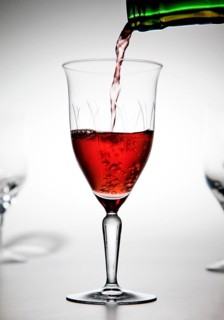 Red wine being poured into a wine glass