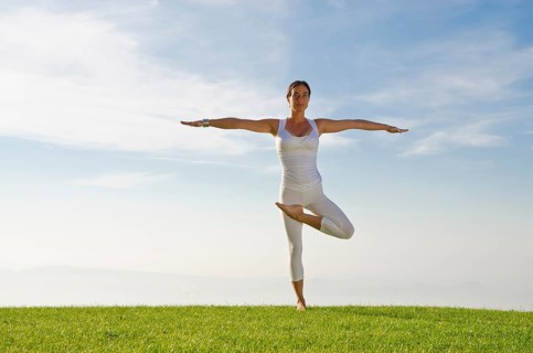 Young woman practising Hatha yoga
