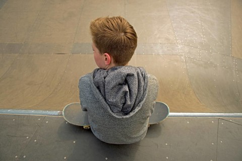 Thirteen-year-old boy with skateboard