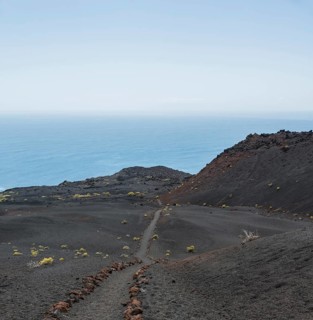 Hiking trail through a lava landscape