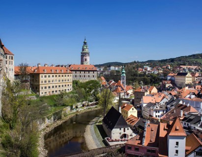 Cesky Krumlov Castle with the castle tower and St. Jost Church