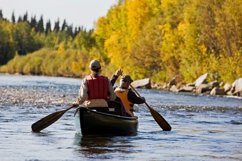 Men rowing a canoe