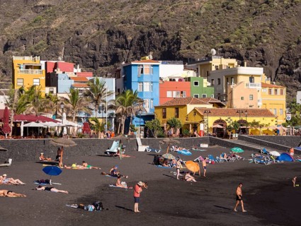 Tourists on the black beach of Puerto de Tazacorte