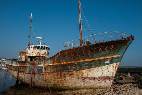 Wreck of an old painted wooden ship