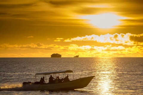 Diving boats with tourists in the evening light