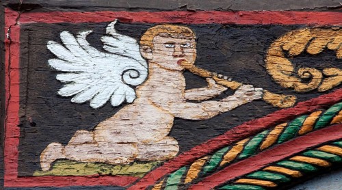 Angel with a flute on a half-timbered house