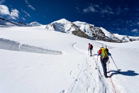 Mountain climbers ascending to Piz Palu Mountain