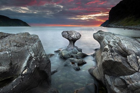 Kannestein or Kanne Stone with coastline at sunset