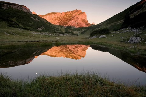 Rofanspitze peak at dawn reflected in Zireiner See