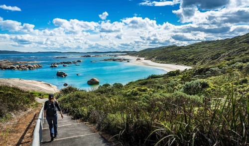 Woman walking down to Greens Pool in William Bay National Park