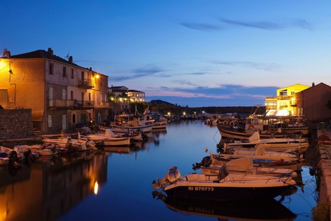 Boats in the harbor at dusk