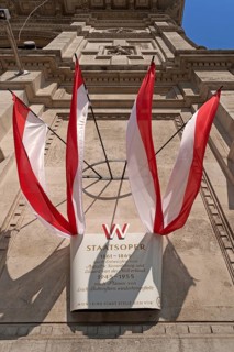 Information board with Austrian flags at the Staatsoper opera house