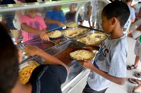 Brazilian boys at the food counter in a social project for street children