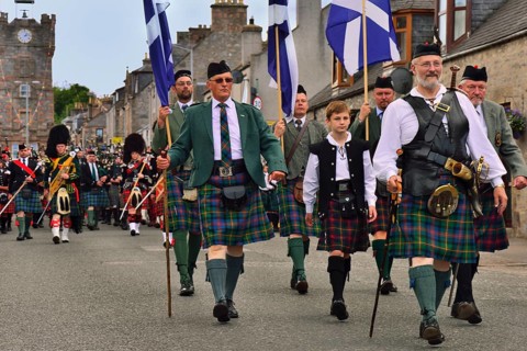 City dignitaries leading the parade of pipe bands