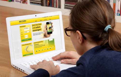 Woman sitting at a laptop surfing the internet