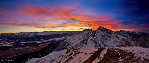 Hafelekar station of the Nordkettenbahnen cable car during a dramatic sunset with Mt Brandjochspitze in the back