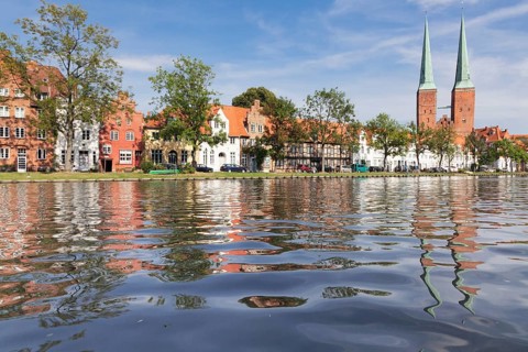 Cathedral reflected in Stadttrave river or Trave River