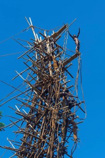 Man jumping from a bamboo tower