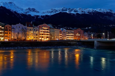 Buildings on the Inn River at dusk
