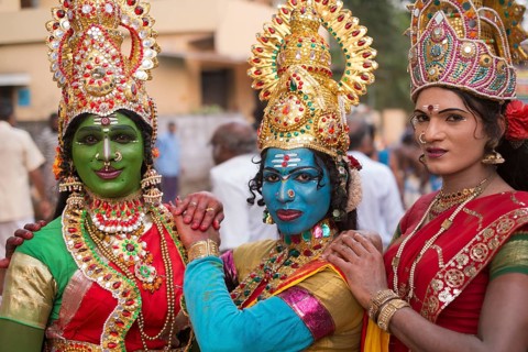 Hindu temple dancers wearing makeup and gold jewelry