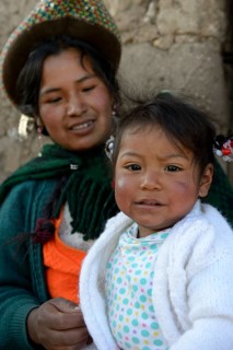 Young woman with girl in traditional costume
