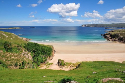 Sandy beach and rocks in Rispond Bay