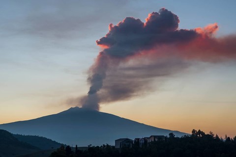 Eruption column above the new southeast crater at sunrise