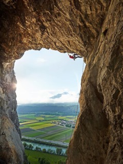 Sport climber climbing in a cave