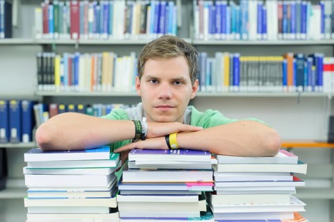 Student studying in the departmental library of the University of Hohenheim in Schloss Hohenheim Palace