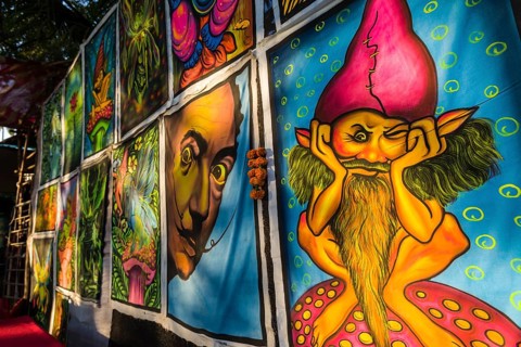 Colourful paintings on cotton sheets for sale at the weekly flea market