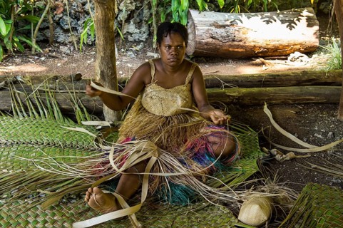 Woman weaving traditional baskets