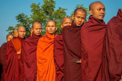 Buddhist monks collecting alms at the temple