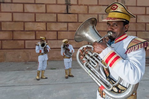Musicians of a brass band wearing uniforms