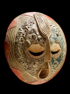 Traditional Ghanaian wooden and metal tribal mask