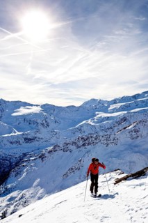 Cross-country skier ascending Kalfanwand Mountain in the Martell Valley