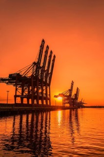 Waltershoferdamm 5 with the cranes of Container Terminal Burchardkai and EUROGATE Container Terminal