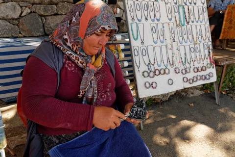 Woman carving a stone