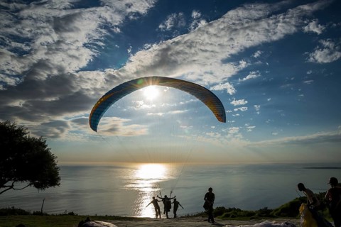 Paraglider at the start to a tandem jump
