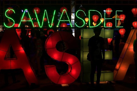 Sawasdee' lettering in neon lights