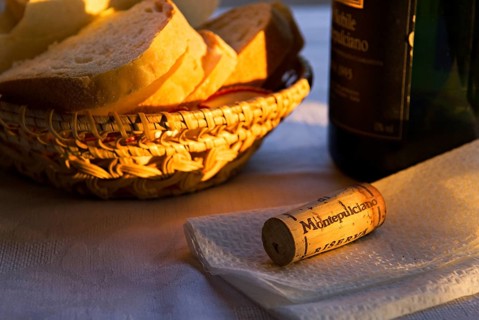 Bread basket with a bottle and a cork