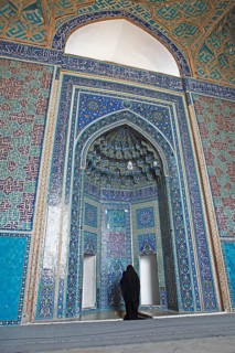 Woman praying in the Masjed-i Jame Mosque or Friday Mosque