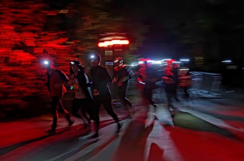 Runners wearing headlamps during a night run