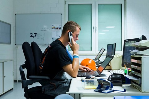 Electrician performing maintenance work on the substation premises of Transmission Control Center